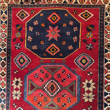 Alfombra caucásica Rusa en lana en tonos rojos y azules 120x190cm